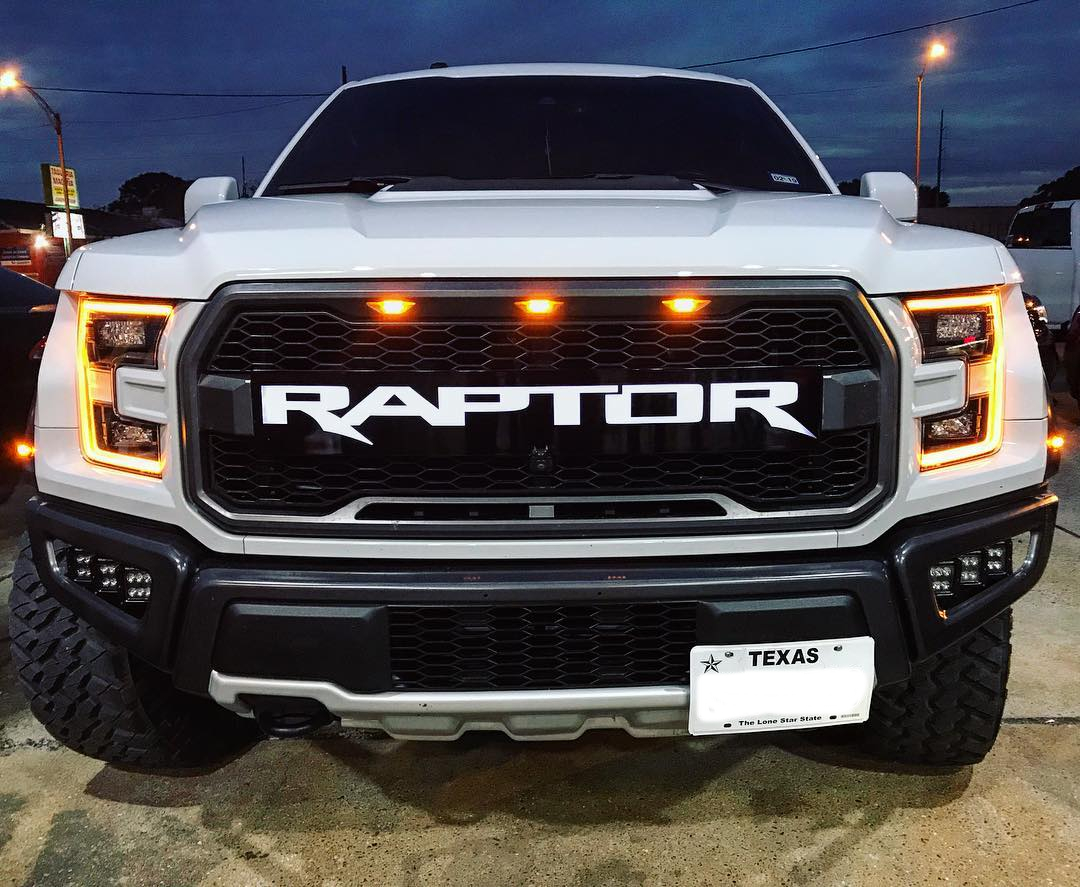 White Ford Raptor vehicle from the supplied photo collection